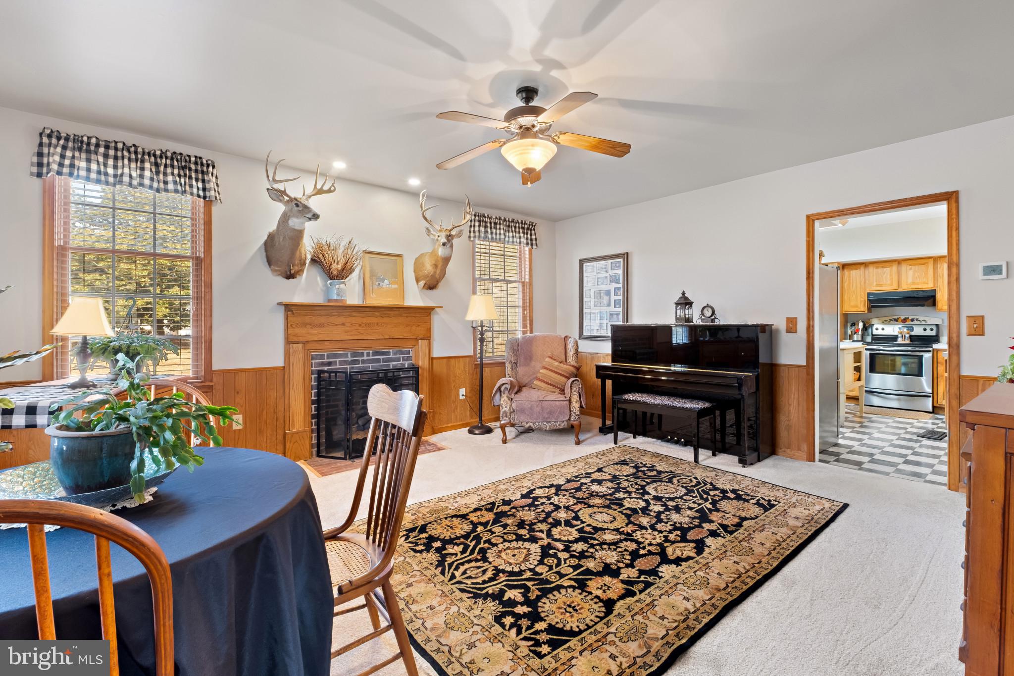3421 Allen Road Eden, MD 21822 - Photo 28 of 56 a living room with furniture a fireplace and a table