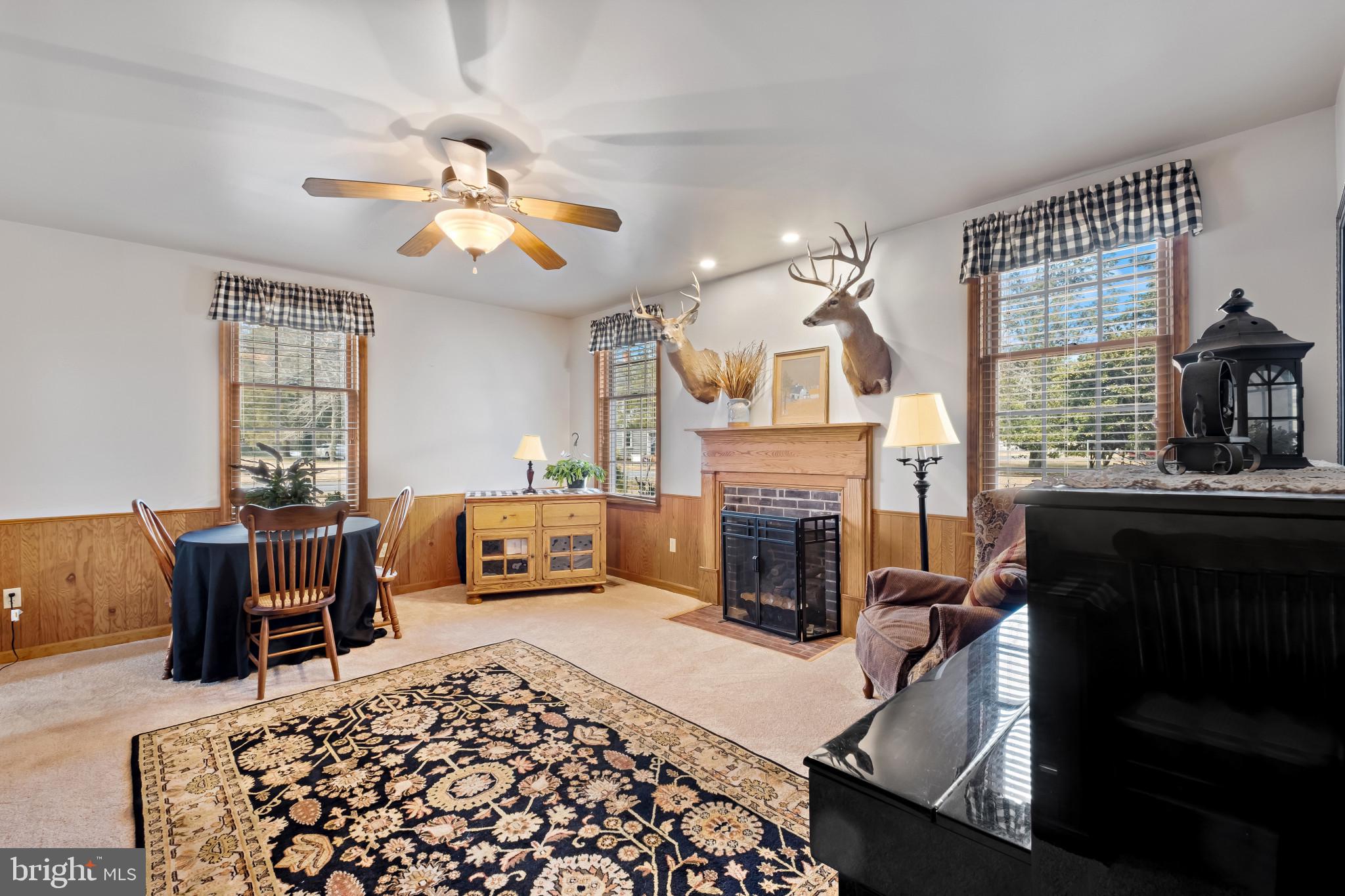 3421 Allen Road Eden, MD 21822 - Photo 29 of 56 a living room with furniture a fireplace and a flat screen tv