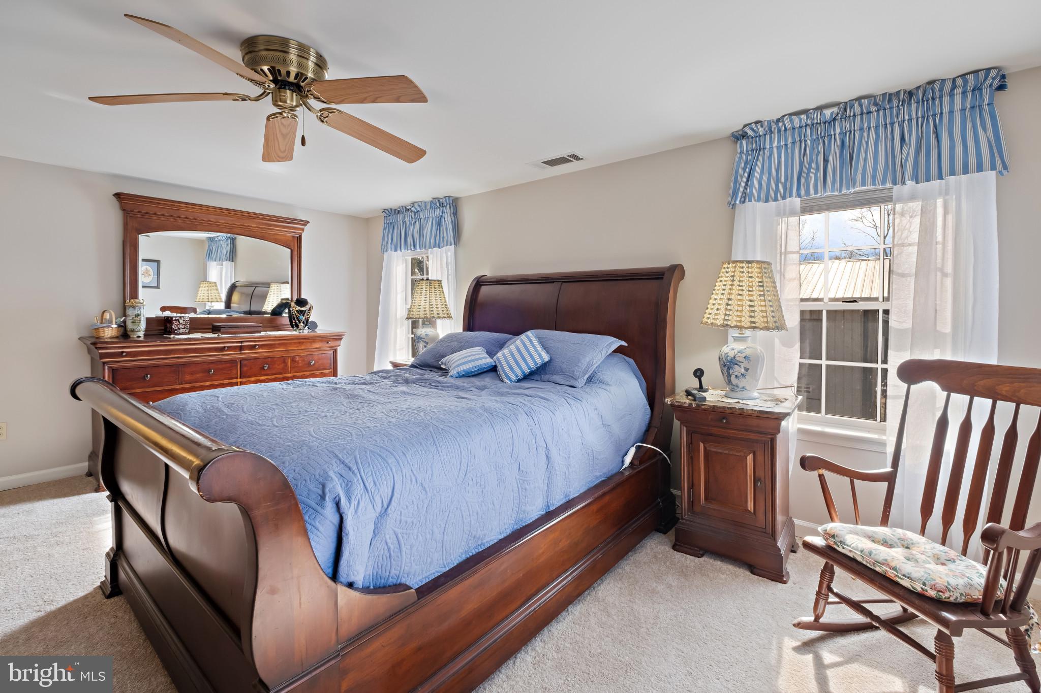 3421 Allen Road Eden, MD 21822 - Photo 31 of 56 a bedroom with a bed and a chandelier