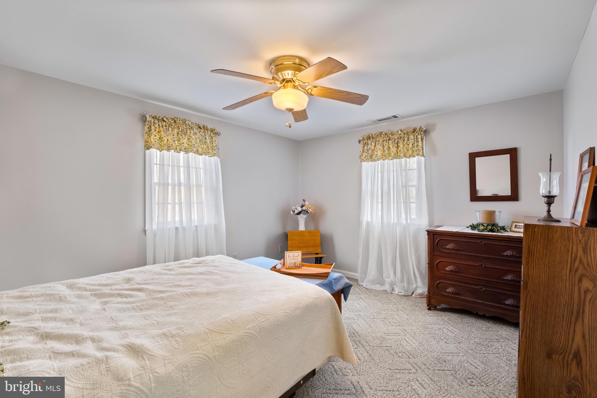 3421 Allen Road Eden, MD 21822 - Photo 34 of 56 a bedroom with a bed and a chandelier