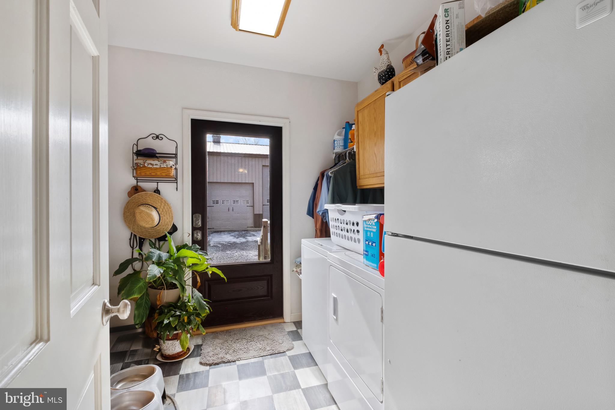 3421 Allen Road Eden, MD 21822 - Photo 51 of 56 a hallway with painting on the wall and a potted plant