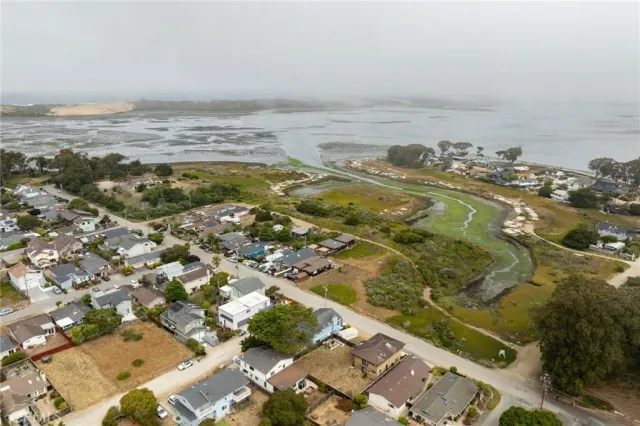 an aerial view of ocean with residential house