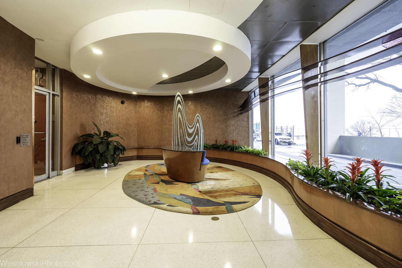 6301 North Sheridan Road, Unit 6C Chicago, IL 60660 - Photo 12 of 20 a view of a living room with a chandelier and entryway