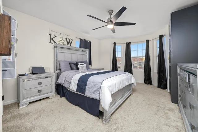 a bed room with a bed and a chandelier