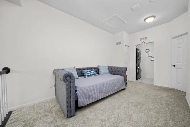 a living room with furniture and a ceiling fan