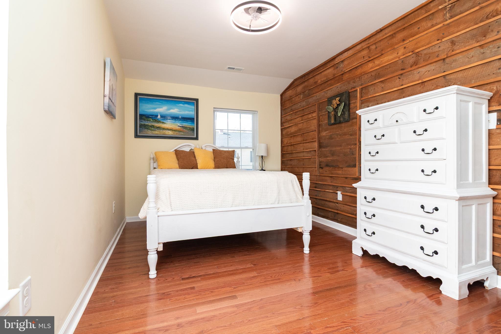 1154 West 6th Street Laurel, DE 19956 - Photo 13 of 27 a bedroom with a bed and lamp