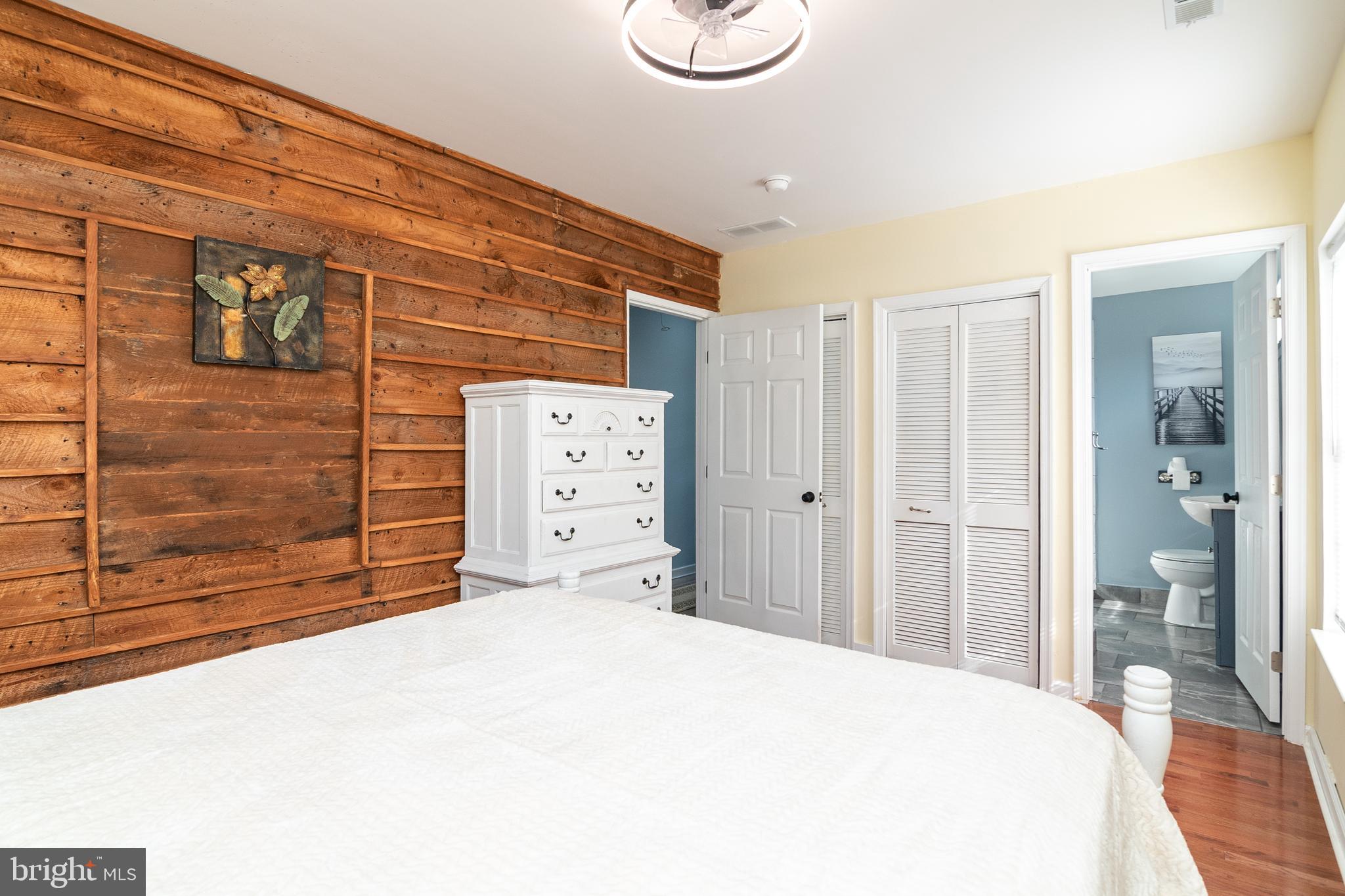 1154 West 6th Street Laurel, DE 19956 - Photo 15 of 27 a bedroom with a bed and a shower