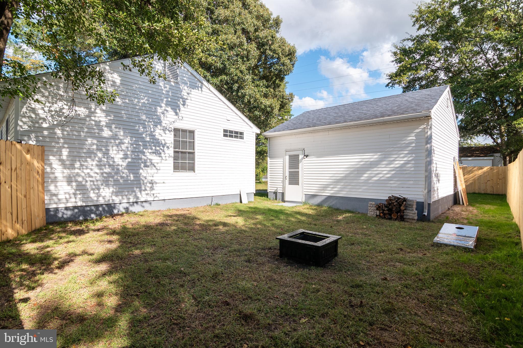 1154 West 6th Street Laurel, DE 19956 - Photo 24 of 27 a view of a backyard with plants and a tree