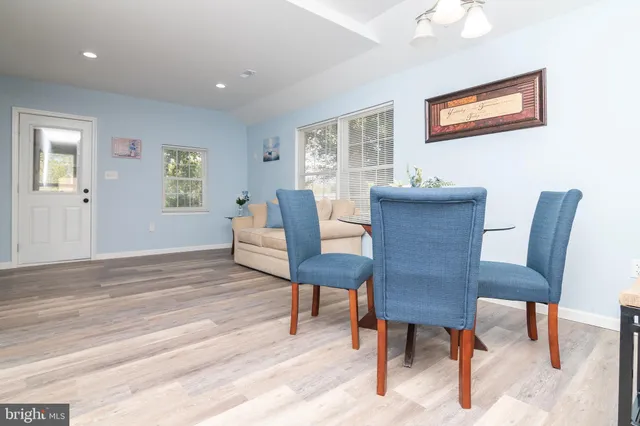 a view of a livingroom with furniture window and wooden floor
