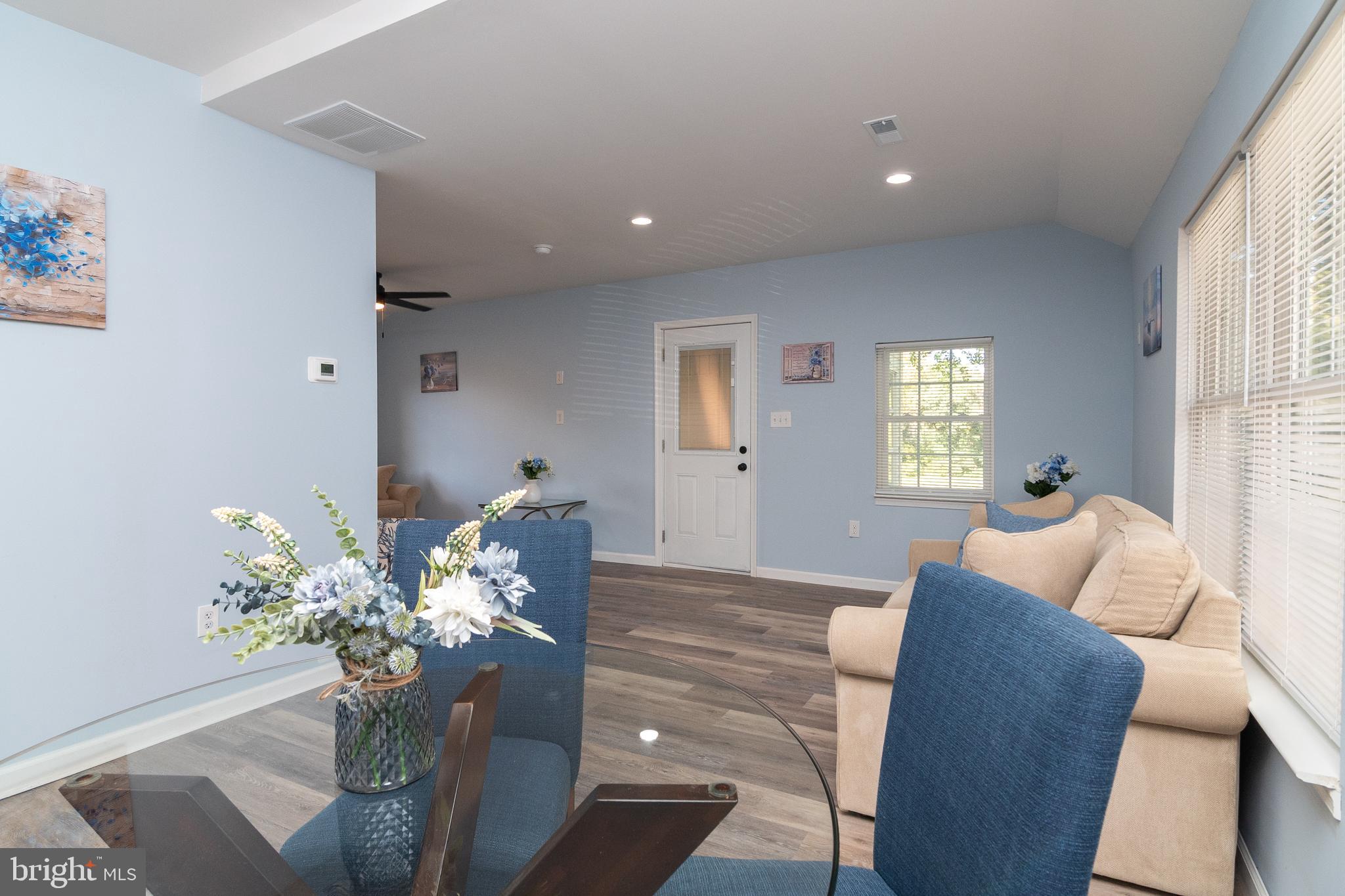 1154 West 6th Street Laurel, DE 19956 - Photo 9 of 27 a living room with furniture flowerpot and a window