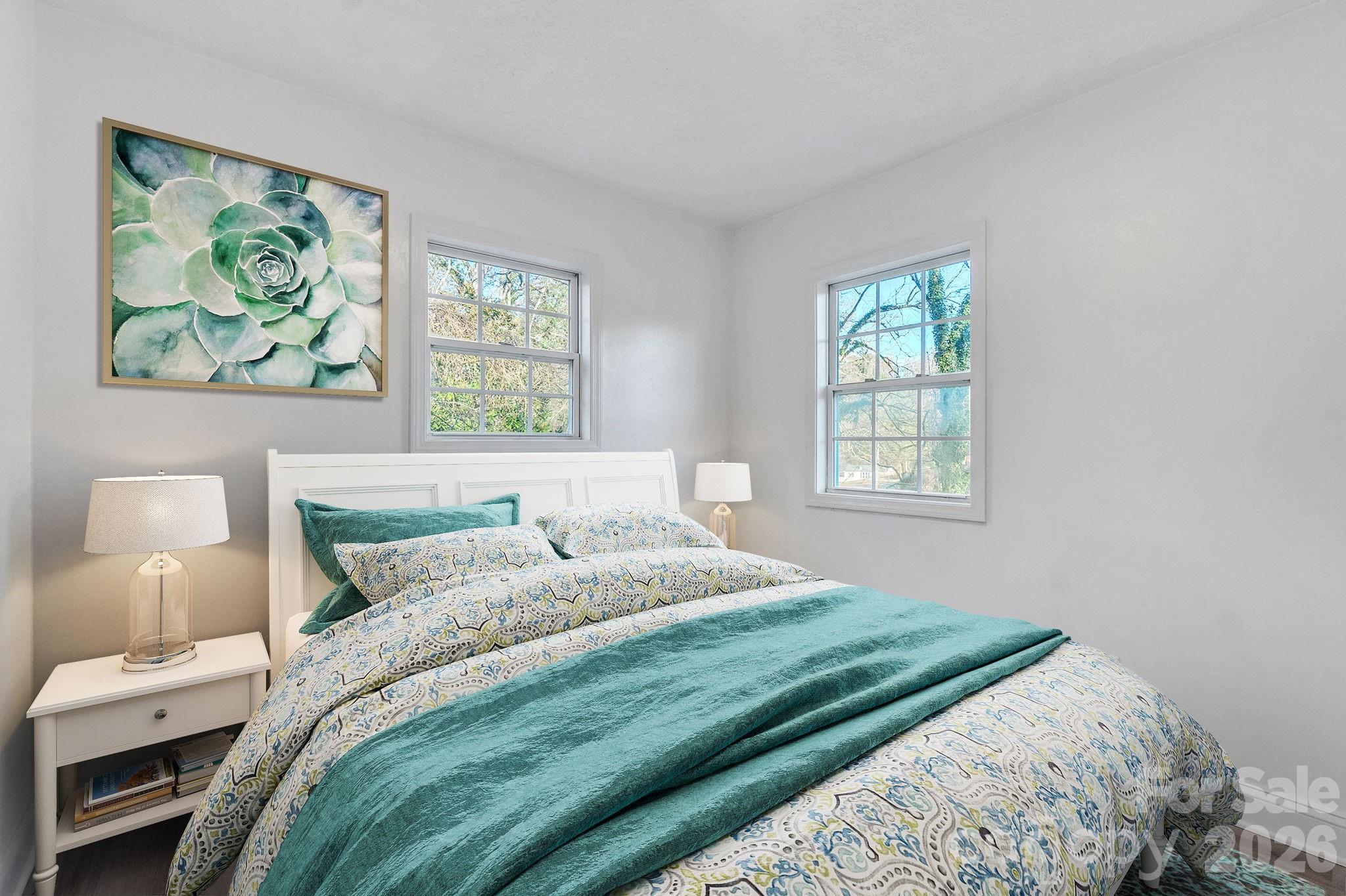 49 East Livingston Street Tryon, NC 28782 - Photo 13 of 27 a bedroom with a bed and a window
