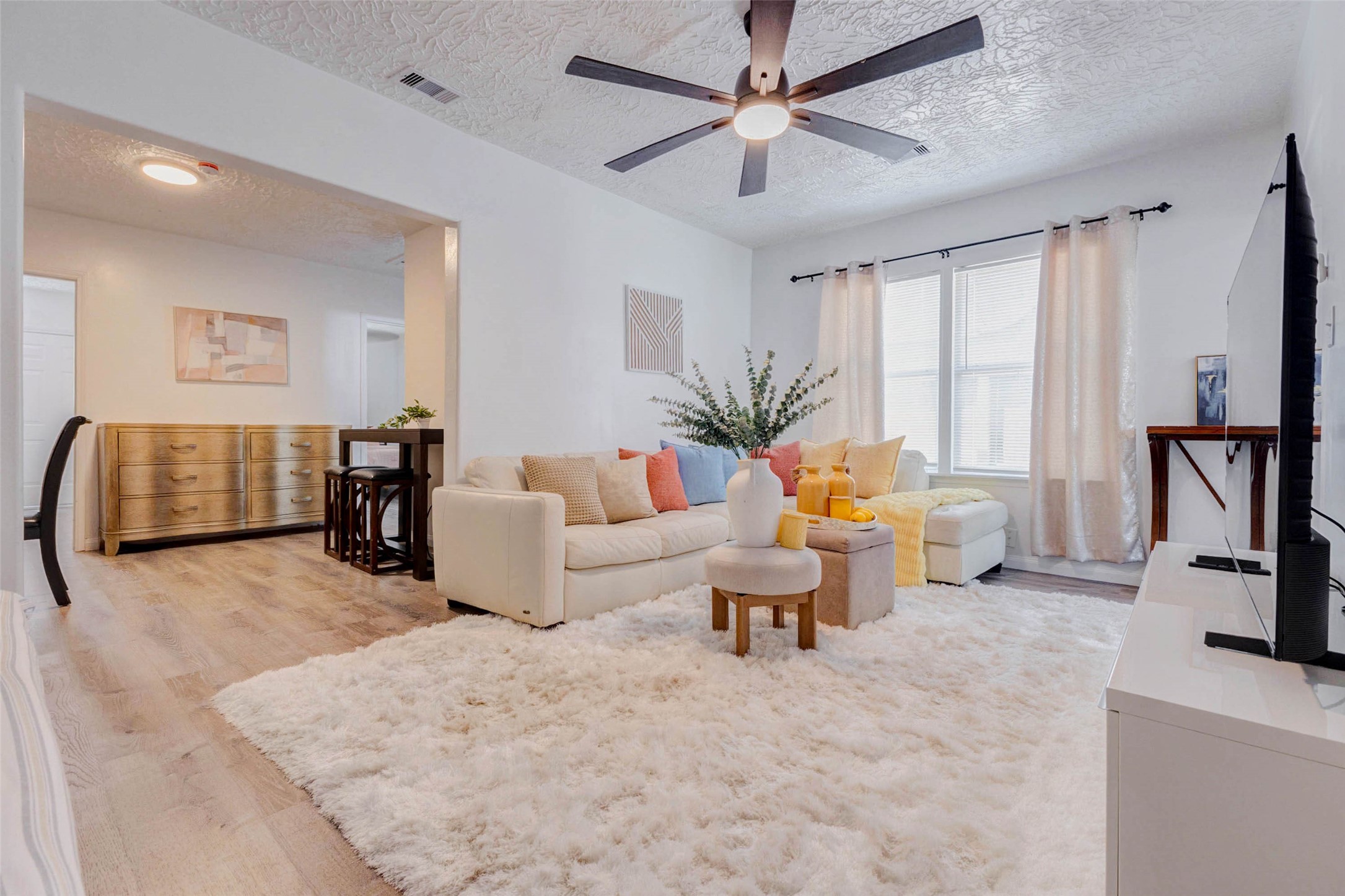 2902 Truxillo Street Houston, TX 77004 - Photo 7 of 32 a living room with furniture and a flat screen tv