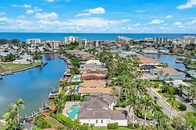 a front view of a house with a yard table and chairs