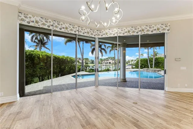 a kitchen with stainless steel appliances kitchen island granite countertop a stove a sink and a refrigerator