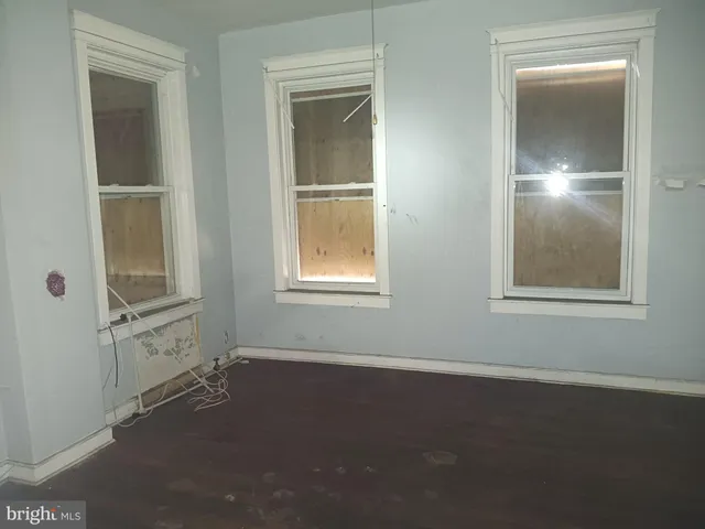 a view of a balcony with yard