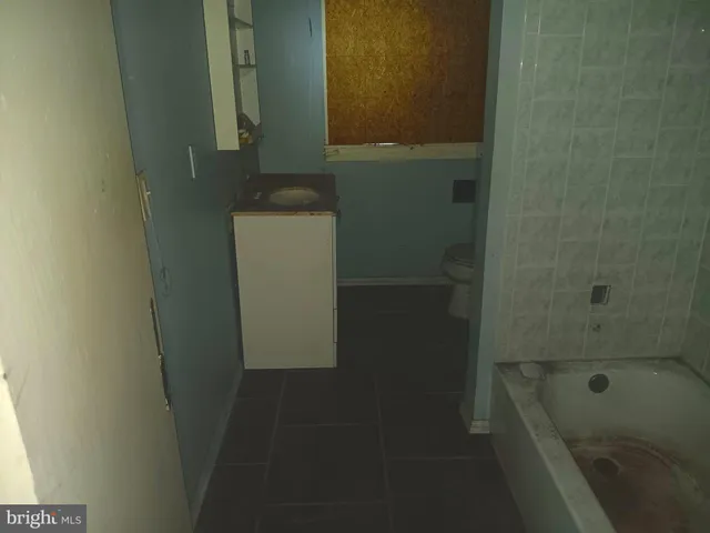 a kitchen with stainless steel appliances a refrigerator and a stove