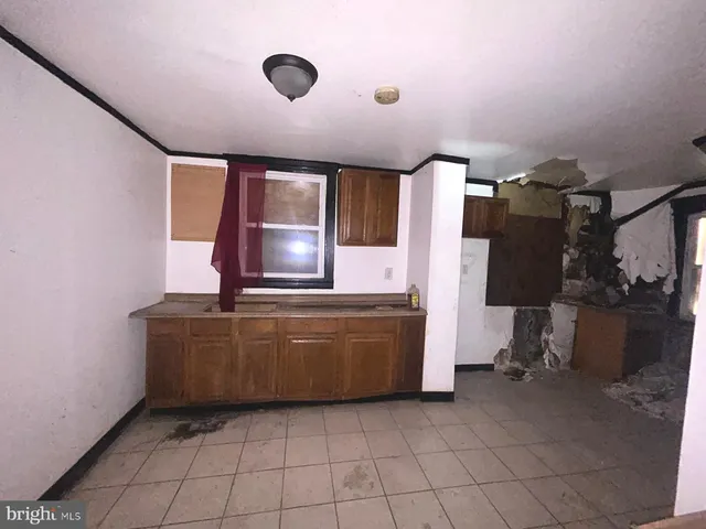 a room with cabinets and flat screen tv