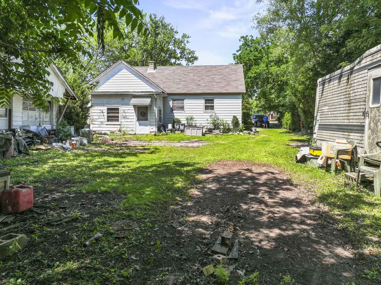 309 Landmeier Road Elk Grove Village, IL 60007 - Photo 3 of 15 a front view of a house with garden