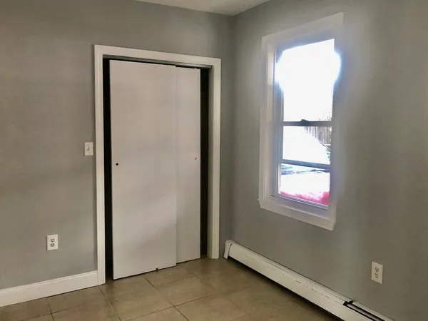 a view of an empty room and window