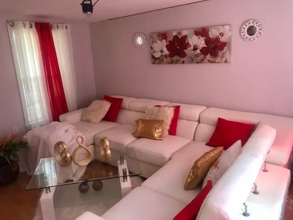 a bedroom with a bed and a painting on the wall