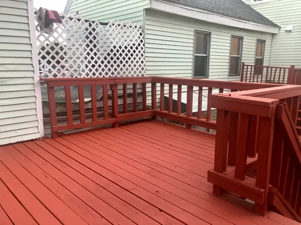 a balcony with wooden floor