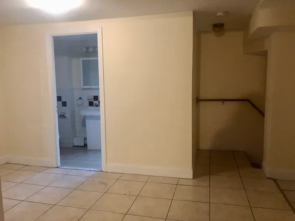 a bathroom with a toilet and a bathtub
