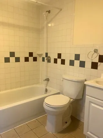 a bathroom with a bathtub and shower