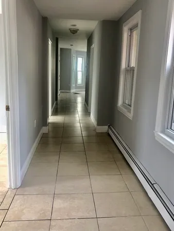 a view of a hallway with windows