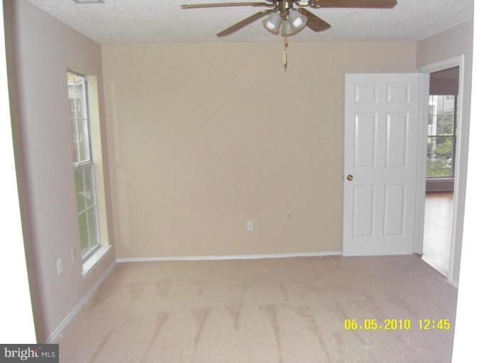 20952 Timber Ridge Terrace, Unit 204 Ashburn, VA 20147 - Photo 8 of 10 Master Bedroom