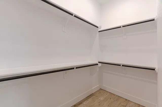 a view of an empty walk in closet