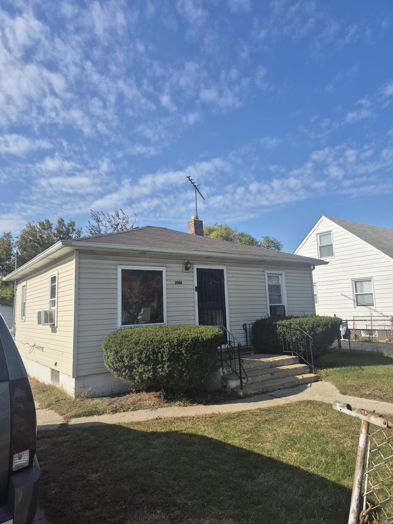2148 Cleveland Street Gary, IN 46404 - Photo 2 of 2 a view of a house with a yard