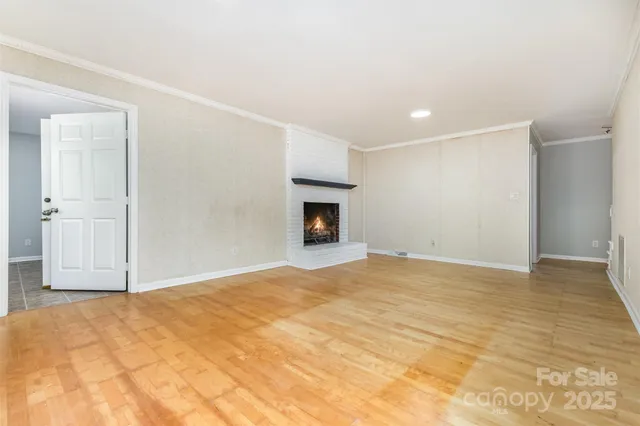 a utility room with a sink a cabinetry and a window