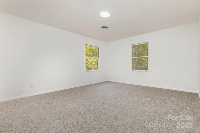 a bathroom with a sink a mirror and a window