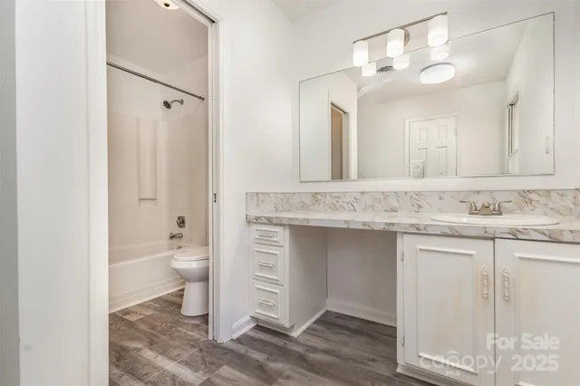 a house with a trees in the background