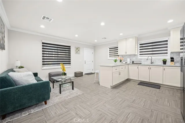 a large white kitchen with a window