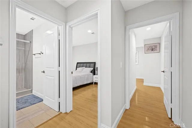 a view of a bathroom from a hallway