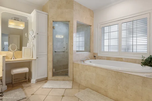 a spacious bathroom with a bathtub and a sink