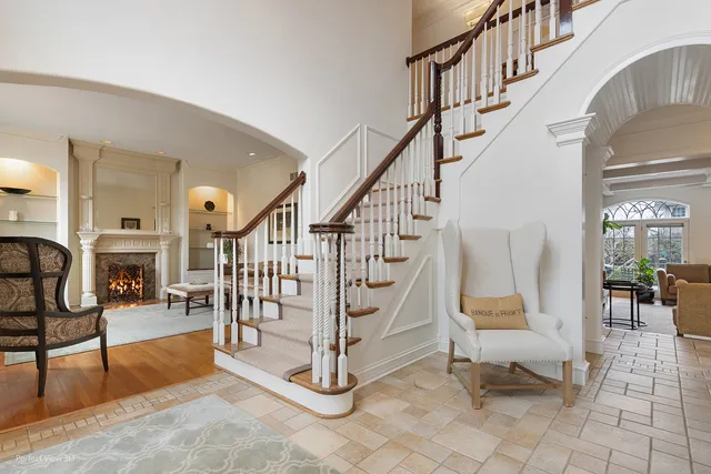 a view of entryway and hall with dining room