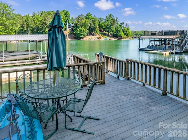 a balcony with table and chairs
