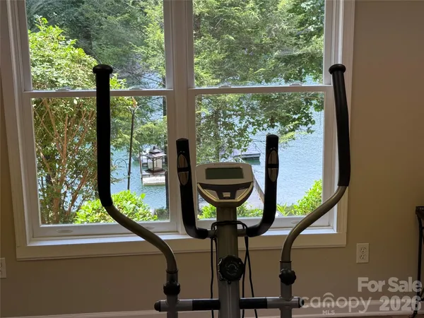 a view of a room with furniture and a window