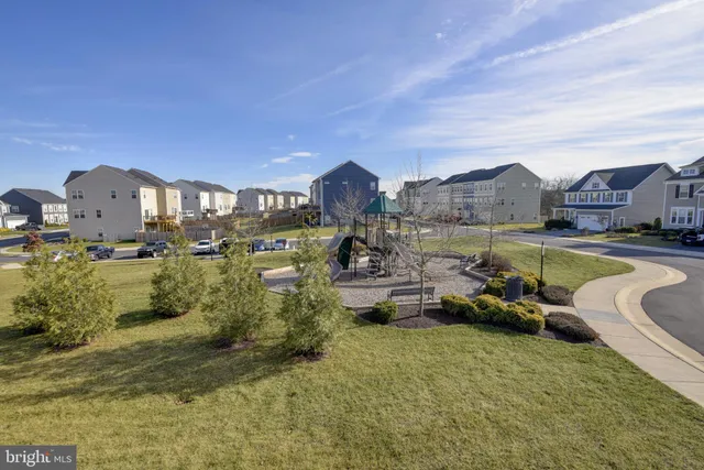an aerial view of a house with a lake view