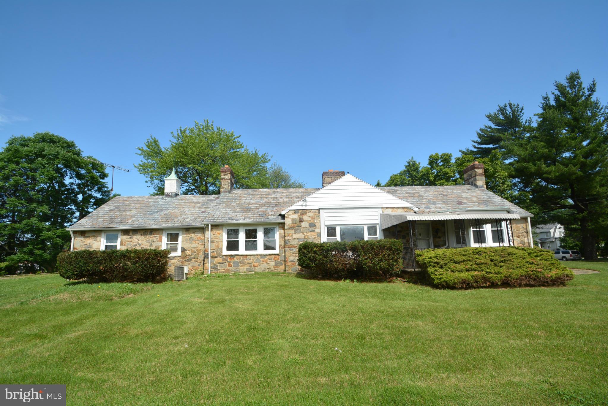 8401 Liberty Road Baltimore, MD 21244 - Photo 1 of 28 a front view of a house with a garden