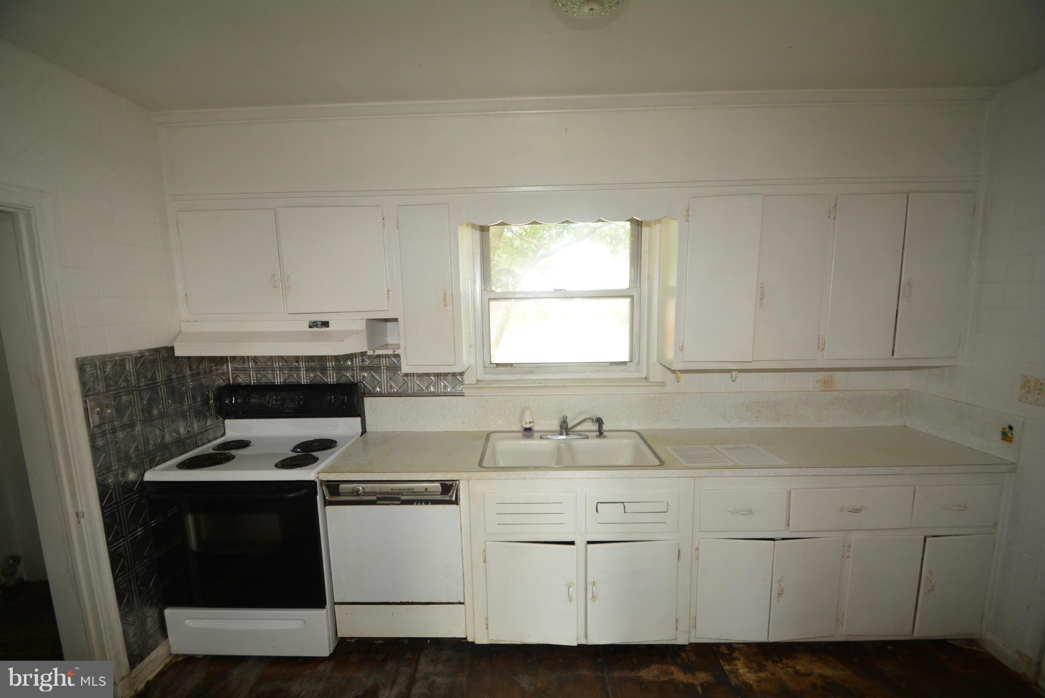 8401 Liberty Road Baltimore, MD 21244 - Photo 11 of 28 a kitchen with a sink cabinets and window
