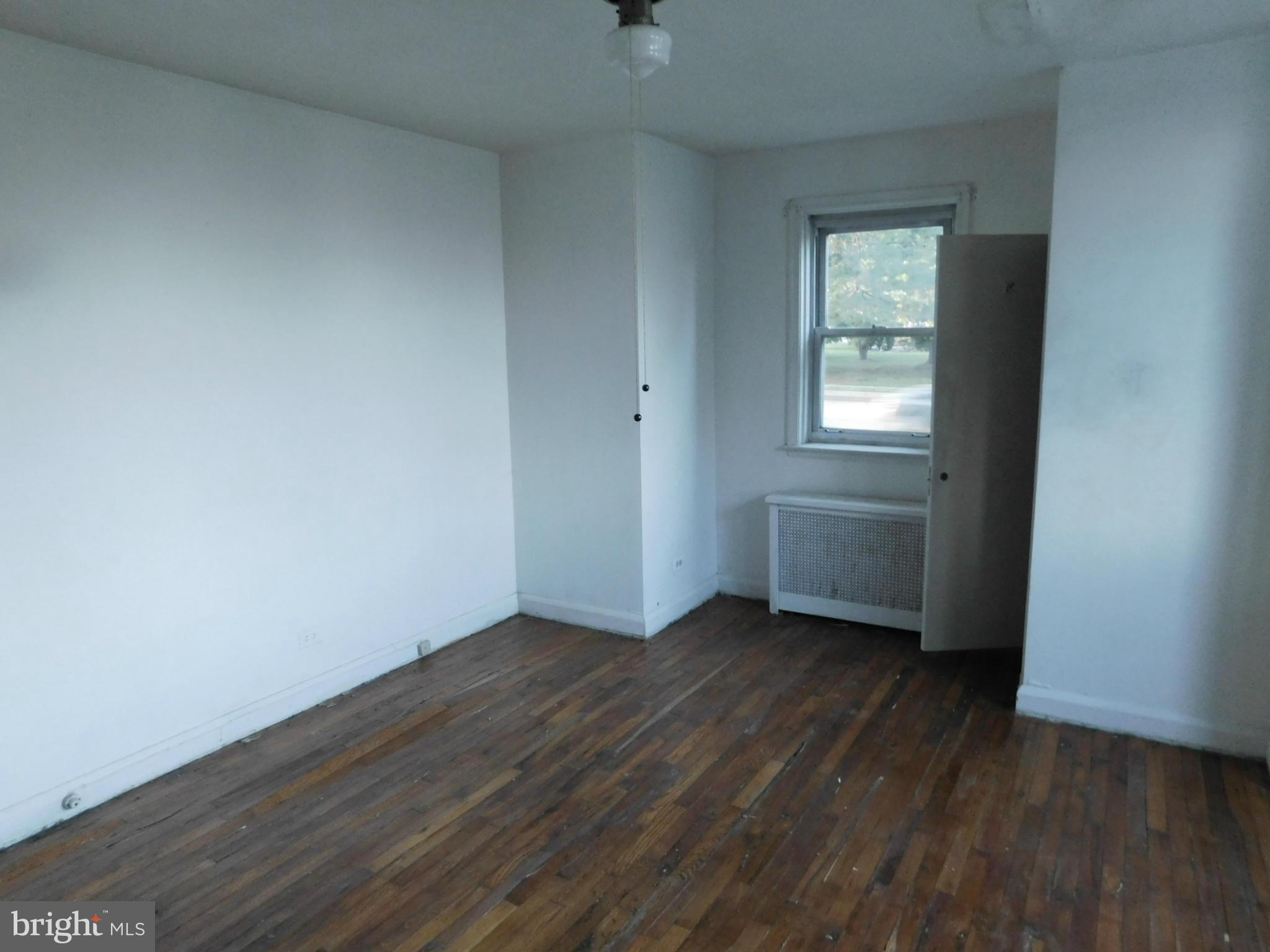 8401 Liberty Road Baltimore, MD 21244 - Photo 23 of 28 an empty room with wooden floor and windows