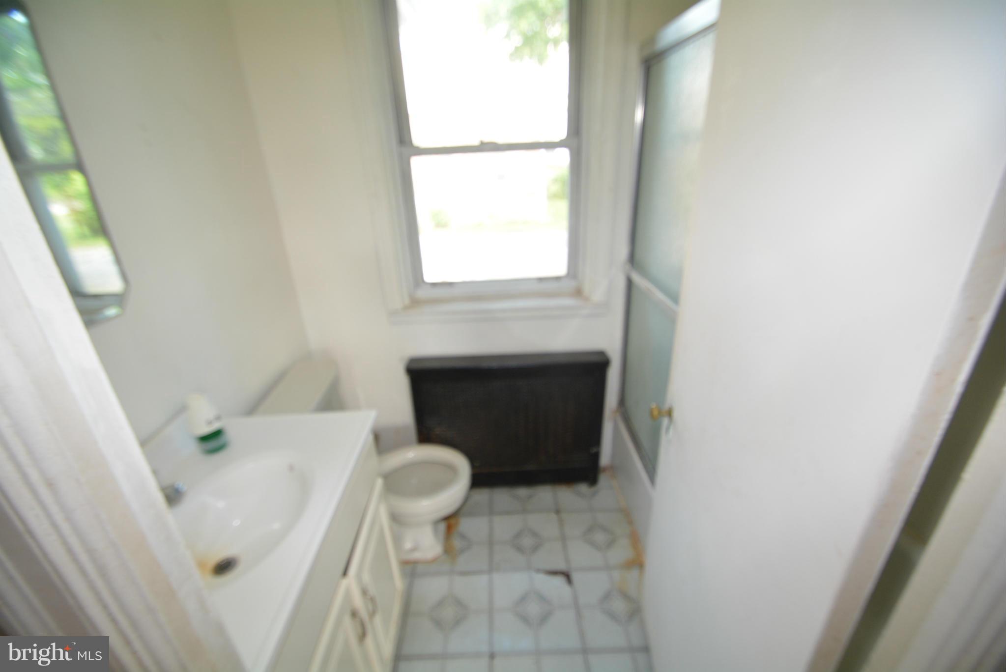 8401 Liberty Road Baltimore, MD 21244 - Photo 10 of 28 a bathroom with a sink and toilet