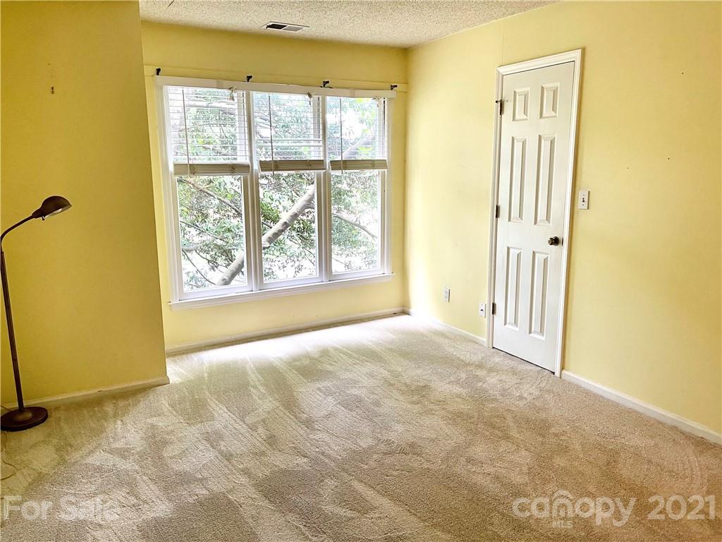 308 Queens Road, Unit 23 Charlotte, NC 28204 - Photo 11 of 22 a view of an empty room with a window