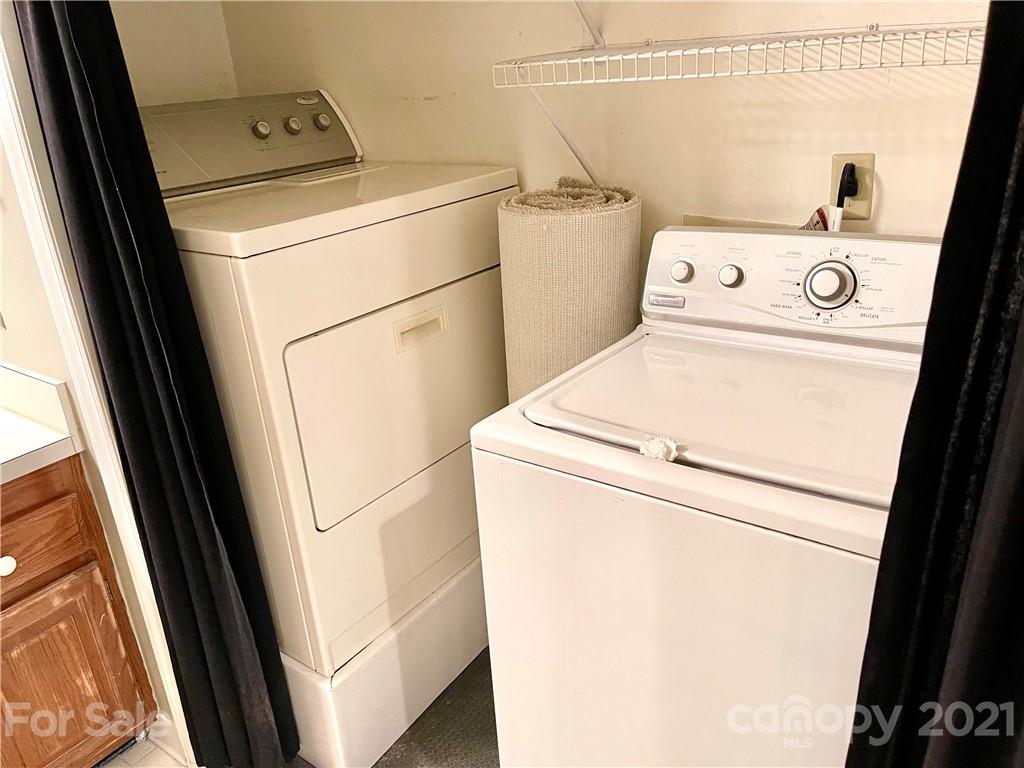 308 Queens Road, Unit 23 Charlotte, NC 28204 - Photo 13 of 22 a utility room with dryer and washer