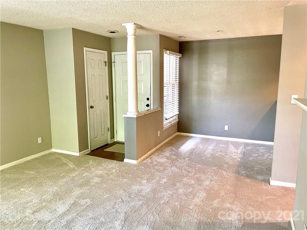 308 Queens Road, Unit 23 Charlotte, NC 28204 - Photo 15 of 22 a view of an empty room with window