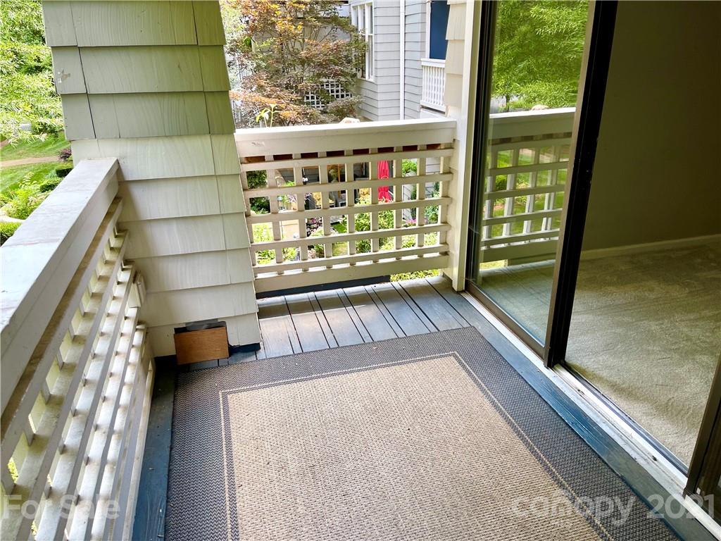 308 Queens Road, Unit 23 Charlotte, NC 28204 - Photo 17 of 22 a view of balcony with floor to ceiling window with outdoor seating