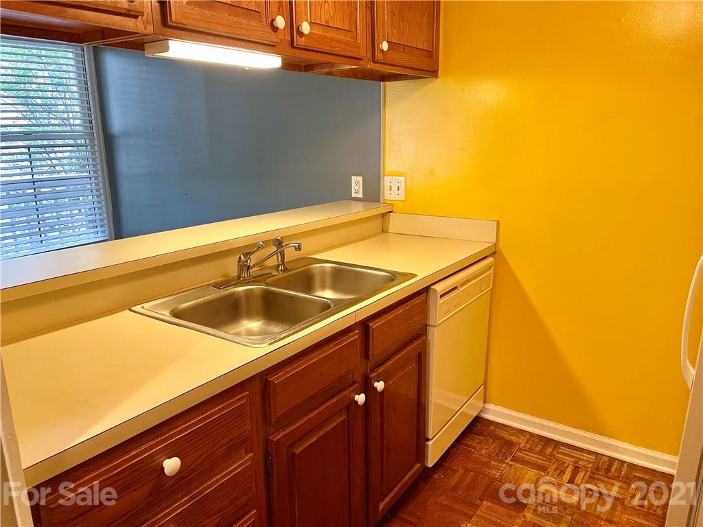 308 Queens Road, Unit 23 Charlotte, NC 28204 - Photo 8 of 22 a bathroom with a sink and cabinets